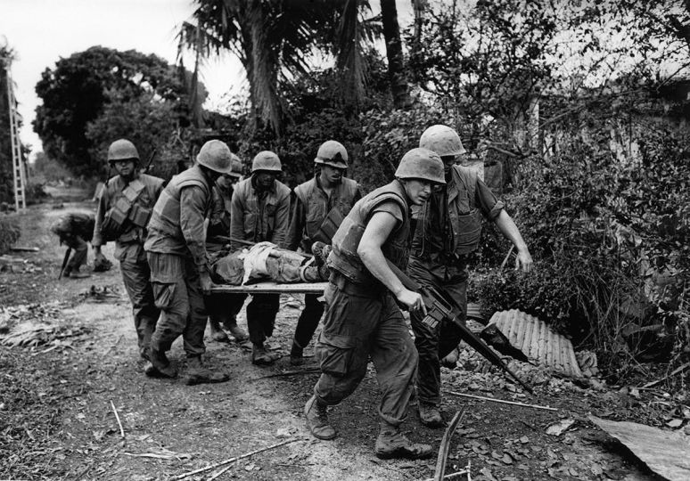 US Marines removing a comrade during the Battle of Hue, Hue, Vietnam, 1968 © Don McCullin. Courtesy Hamiltons Gallery