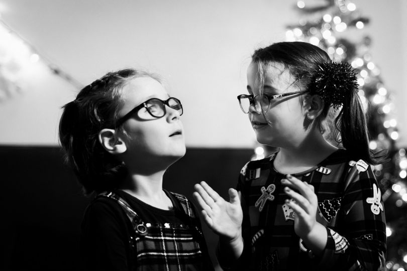 At a Christmas party, Montreal (Canada) December 3rd 2023. Noémie, 6 years old, has been blind since birth. She is attending the Christmas Party organized by the Quebec Foundation for the Blind. She is dancing with Florence while they wait for « Santa to arrive ». Noémie is affected by Leber congenital amaurosis (LCA). She wears glasses to protect her eyes because she has no muscle reflex in her eyelids. © Ophélie Chauvin