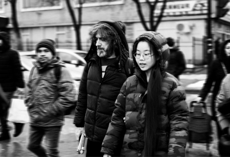 In the streets of Montreal (Canada), December 10th 2023. Marc-André has the daily support of Hao Yu (26 years old). She is his neighbor, friend, and guide. For Marc-André, it is essential to have a relationship of trust with his guide. © Ophélie Chauvin