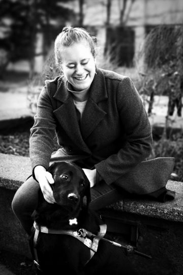 In the campus of University of Montreal, (Canada), November 27th 2023. For the past two years, Marie has been able to count on the support of Djenga, her guide dog. To obtain him, she spent six months at a specialized school in the USA, where she felt less 'infantilized' than in Canada. With Djenga, in contrast to the white cane, she feels much more autonomous, free, and safe. She also notices that people are more willing to come talk to her and socialize. © Ophélie Chauvin