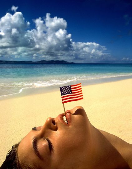 Cindy Crawford with Flag, U.S. Virgin Islands, 1993 © Albert Watson, courtesy of Fahey/Klein Gallery, Los Angeles
