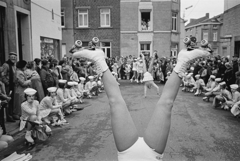 BELGIUM. Fleurus. 11/04/1982: Roller-skate group during parade at festival. © John Vink
