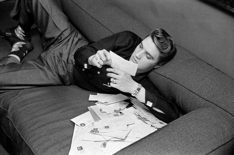 Elvis Reading His Fan Mail, Warwick Hotel, New York, New York, March 17, 1956 © Alfred Wertheimer / MUUS Collection